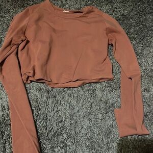 Brownish orange long sleeve is cropped